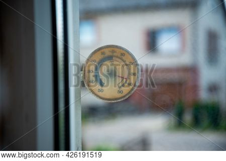 A Plastic Transparent Square Thermometer Shows A High Temperature Of 36 Degrees Celsius