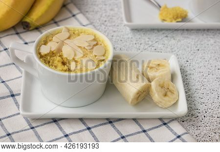 Homemade Portioned Banana Bread Mugcake In Small Mugs.