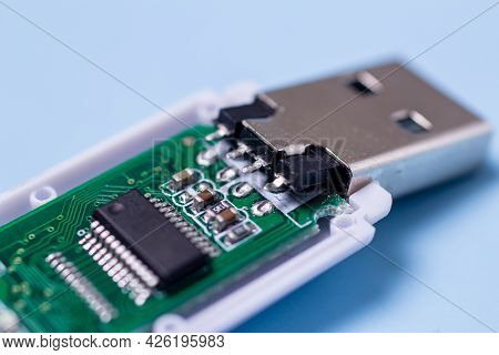 Damaged Uncover Usb Stick With A Board On A Blue Background