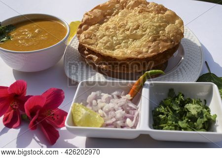 Popular Delicious Sindhi Cuisine Dish Item Dal Pakwan With Chopped Onions, Coriander, Green Chilly. 