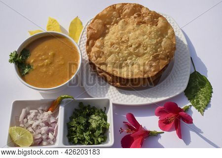 Popular Delicious Sindhi Cuisine Dish Item Dal Pakwan With Chopped Onions, Coriander, Green Chilly. 