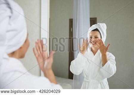 Young Girl Doing Facial Gymnastics Self Massage And Rejuvenating Exercises In The Morning After Taki