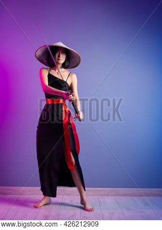 Slender Asian Woman An Asian Hat With A Katana In Her Hand Image Of A Samurai