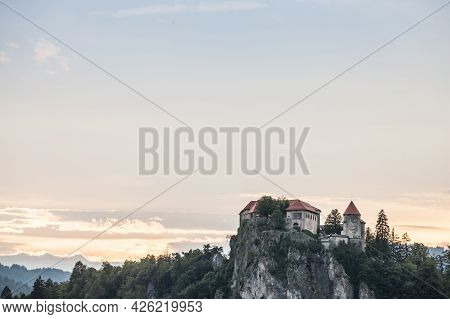 Selective Blur On The Bled Castle, Also Called Blejski Hrad, During Summer, At Sunset, By The Mounta
