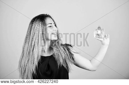 Be Yourself. Pretty Woman Hold Perfume. Elegant Smell. Cosmetic Care. Woman With Bottle Of Perfume. 