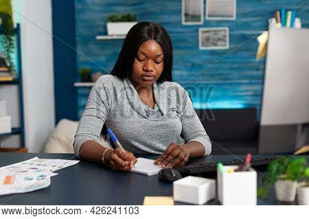 African American Student Writing High School Homework On Notebook During Online Communication Course