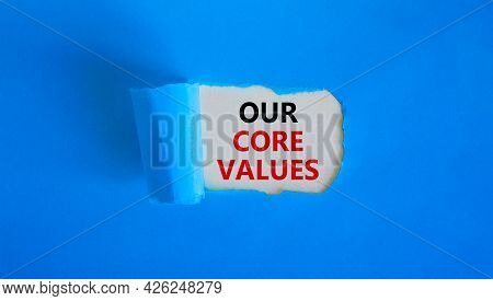 Our Core Values Symbol. Words 'our Core Values' Appearing Behind Torn Blue Paper. Beautiful Blue Bac
