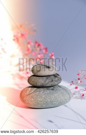 Stack Of Basalt Stones On White Background. Trendy Shadows. Gypsophila Or Baby's Breath Flowers. Sum