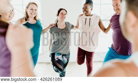 Group of people doing quadriceps stretching