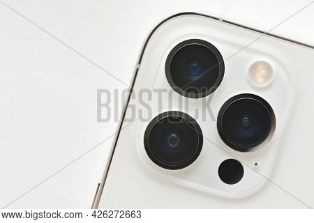 Stariy Oskol, Russia - July 5, 2021: Camera Lenses Of Modern Apple Smartphones Iphone 12 Pro