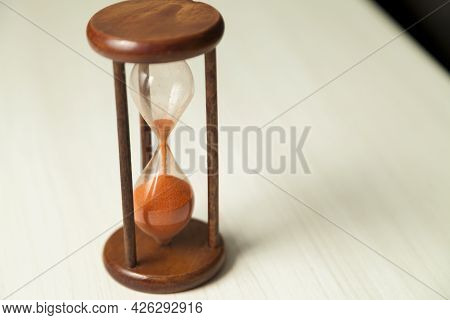 Hourglass With Concept Of Passing Time, Race Against Time, Urgency And Priority. Hours, Days, Weeks,