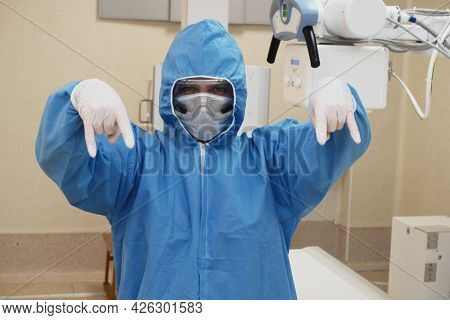 The Work Of A Radiologist In Antiviral Overalls In The X-ray Room For Diagnostics.