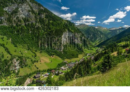 Summer Valley With Grossarler Ache Small River And Blue Cloudy Sky