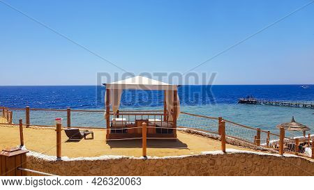 Beach Gazebo With Curtains For Relaxing On The Beach Red Sea Next To A Coral Reef In Sharm El Sheikh