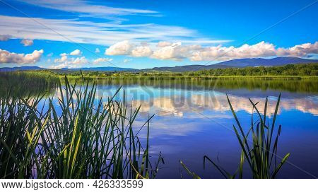 Landscape Of A Beautiful Lake With Clouds Reflection