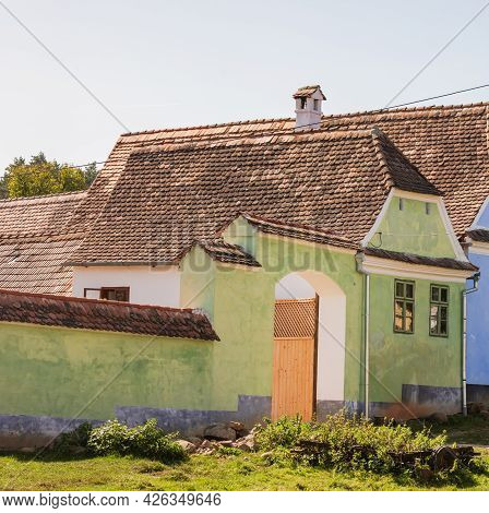 View Of Picturesque Village Viscri In Romania. Painted Traditional Old Houses In Medieval Saxon Vill