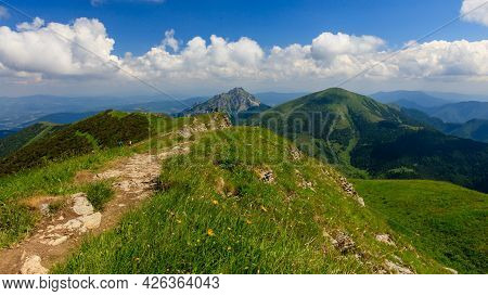 Green Mountain Ridge In Nice Weather, With Blue Sky And White Clouds. Chleb, Mala Fatra, Slovakia.
