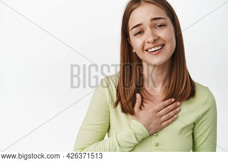 Oh Thank You, Thats So Sweet. Touched And Flattered Young Woman Face, Hold Hand On Chest And Smiling