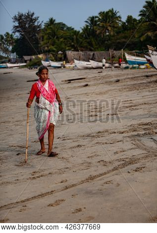 Morjim, North Goa, India , 01 April 2016 Indian Women Walks Along The Coast Along The Ocean