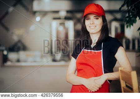 Happy Smiling Fast-food Worker Standing In A Restaurant