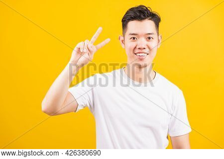 Portrait Happy Asian Handsome Young Man Smiling Standing Wearing White T-shirt He Showing Fingers Do