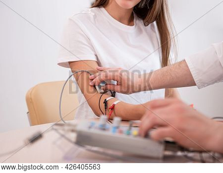 Patient Nerves Testing Using Electromyography At Medical Center