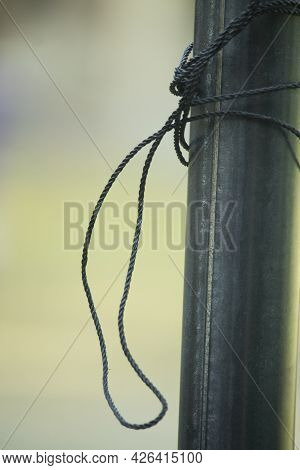 Lalon's Rope Is Tied To A Steel Pole To Pull The Flag