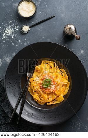 Fettuccine Pasta With Traditional Italian Passat Sauce And Parmesan Cheese In Light Plate On Old Whi