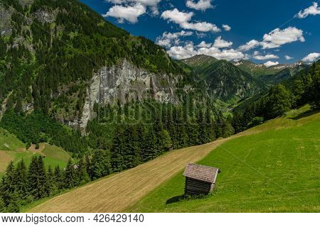 Summer Valley With Grossarler Ache Small River And Blue Cloudy Sky