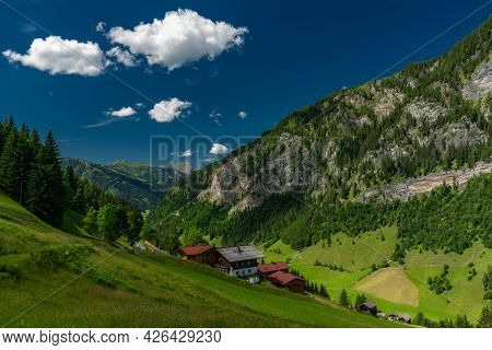 Summer Valley With Grossarler Ache Small River And Blue Cloudy Sky