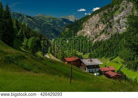 Summer Valley With Grossarler Ache Small River And Blue Cloudy Sky