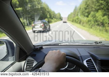 Overtaking A Car.a Dangerous Maneuver On The Road.driving A Car.