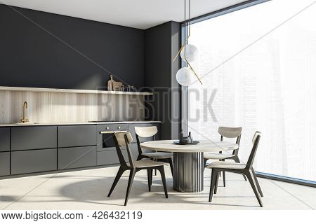 Corner Of Of The Dark Grey Panoramic Kitchen Area With Light Wooden Table, Chairs And Splashback Of 