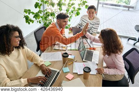 Young Happy Laughing Creative Team Four Multicultural Coworkers Or College Students Group Celebrate 