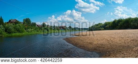 Beautiful Landscape View With A Village On The Bank Of A Forest River In Summer Sunny Day.
Wide Dist