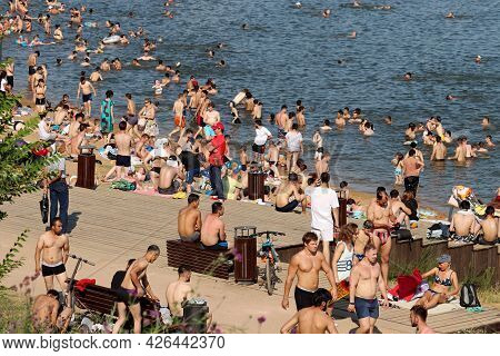 Moscow, Russia - July 2021: Large Crowd Of People Sunbathing And Swimming On A Beach Of Moscow River