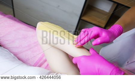 The Process Of Removing Unwanted Sugar Paste Hairs From The Hand Of The Master Model Tears Off The S