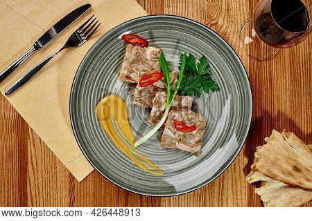 Georgian Jellied Pork Mujuji With Mustard, Shotis Puri And Wine