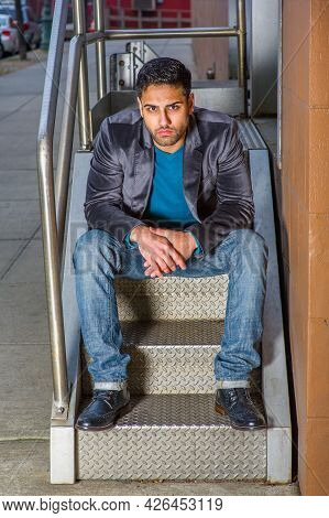 Dressing In A Dark Purple Woolen Blazer,  Jeans And Leather Shoes , A Young Handsome Worker With Bea