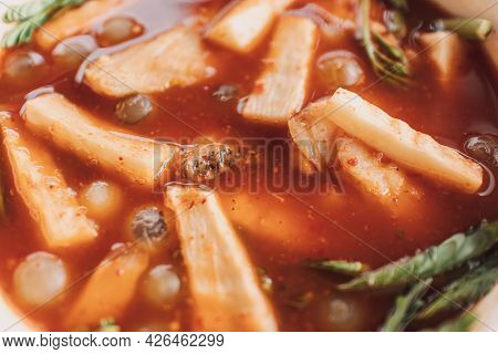 Thai Ryukyu Roe Sour Soup Served In White Bowl On White Table.