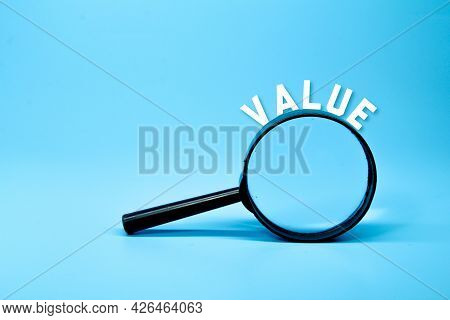 Magnifying Glass With The Word Value. Business Concept