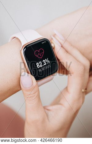Woman wearing a smartwatch mockup to check her heart rate
