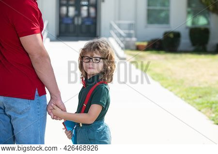 Father Supports And Motivates Son. Kid Going To Primary School.
