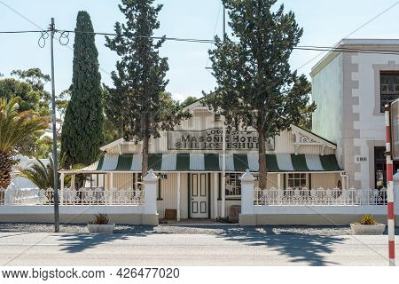 Matjiesfontein, South Africa - April 20, 2021: A Street Scene, With Logans Masonic Hotel, In The His