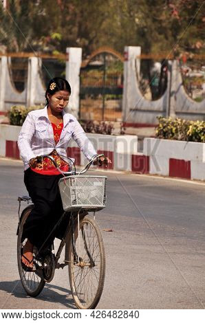 Burmese Women Biking Bicycle On Street With Traffic Road Of Mandalay City And Burma People And Forei