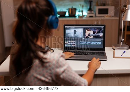 Movie Maker Editing A Film Using Modern Software For Post Production. Content Creator In Home Workin