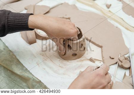 Women's Hands Knead Clay, Drawing Elements Of The Product. Production Of Ceramic Products At The Mas