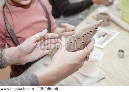 Women's Hands Knead Clay, Drawing Elements Of The Product. Production Of Ceramic Products At The Mas