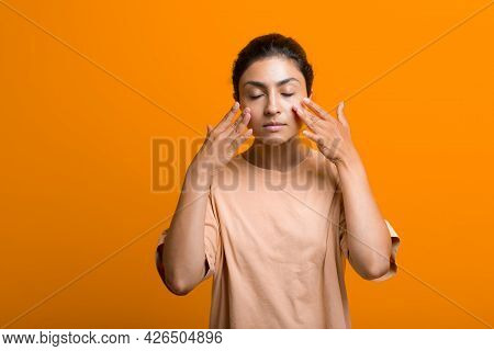 Close Up Portrait Of Young Indian American Woman Doing Facebuilding Yoga Face Gymnastics Yoga Self M