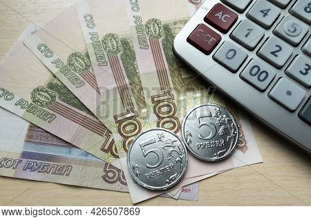 Russian Money Spread Out In A Fan And A Calculator.